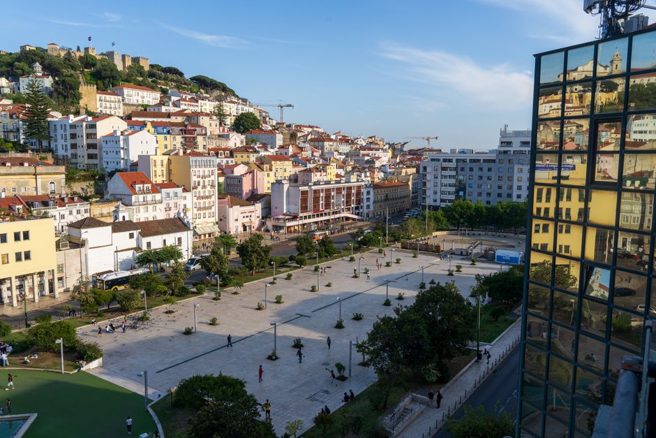 A vibrant aerial capture of Lisbon's colorful town square and architecture.