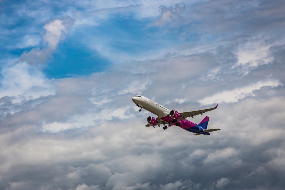 A commercial airplane in flight against a dynamic cloudy sky, showcasing modern air transportation.