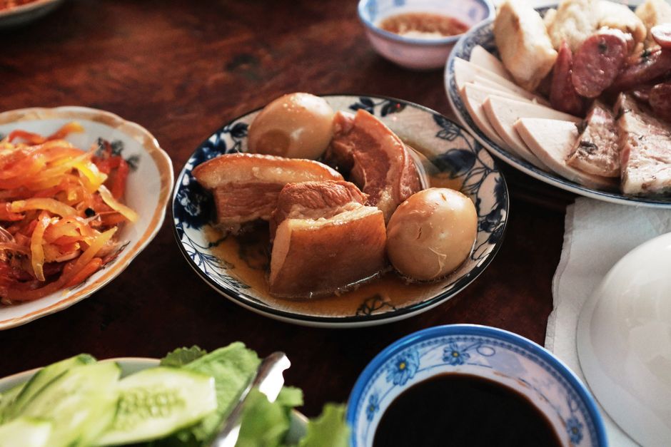 A colorful and authentic Vietnamese meal showcasing traditional dishes for Tet celebration in Ben Tre, Vietnam.